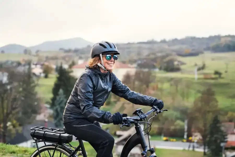 a side view of senior woman with electrobike