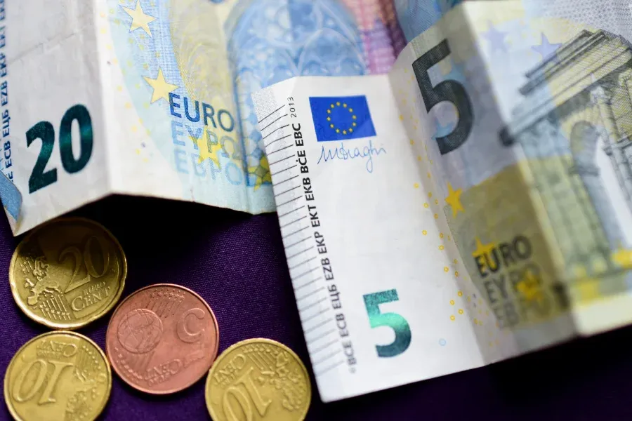 cash-euro-money-on-purple-background